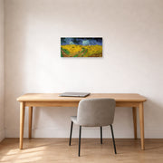 Unframed poster print of Vincent van Gogh's Wheat Field with Crows displayed on a wall in a home office