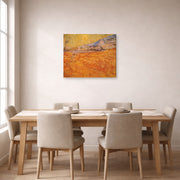 Gallery-wrapped canvas print of Vincent van Gogh's Wheat Fields with Reaper at Sunrise displayed on a wall in a dining room