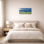 Gallery-wrapped canvas print of Vincent van Gogh's Wheatfield Under Thunderclouds displayed on a wall in a bedroom