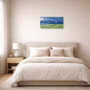 Unframed poster print of Vincent van Gogh's Wheatfield Under Thunderclouds displayed on a wall in a bedroom