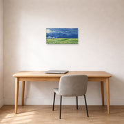 Unframed poster print of Vincent van Gogh's Wheatfield Under Thunderclouds displayed on a wall in a home office