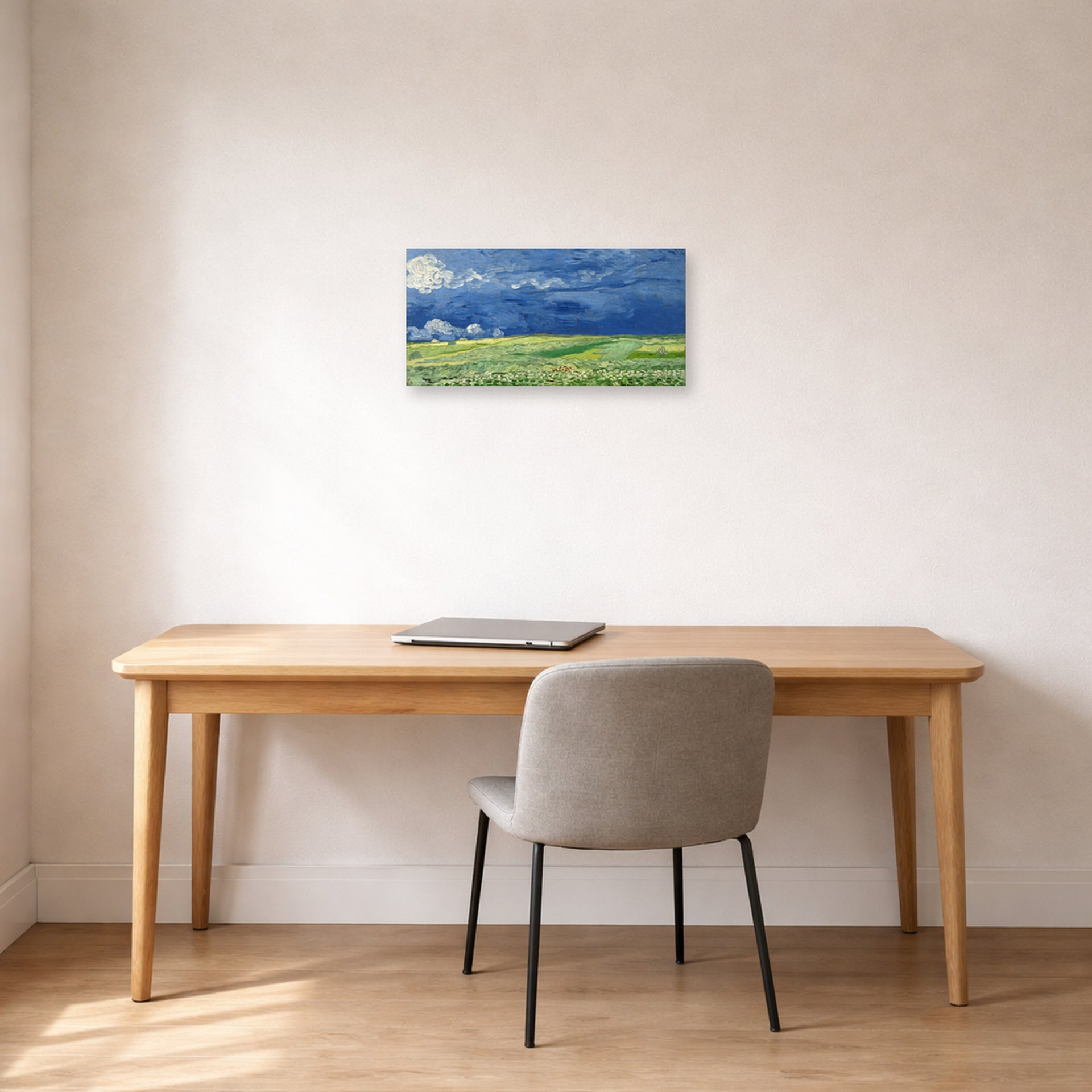 Unframed poster print of Vincent van Gogh's Wheatfield Under Thunderclouds displayed on a wall in a home office
