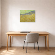 Gallery-wrapped canvas print of Vincent van Gogh's Wheatfield with a Reaper displayed on a wall in a home office