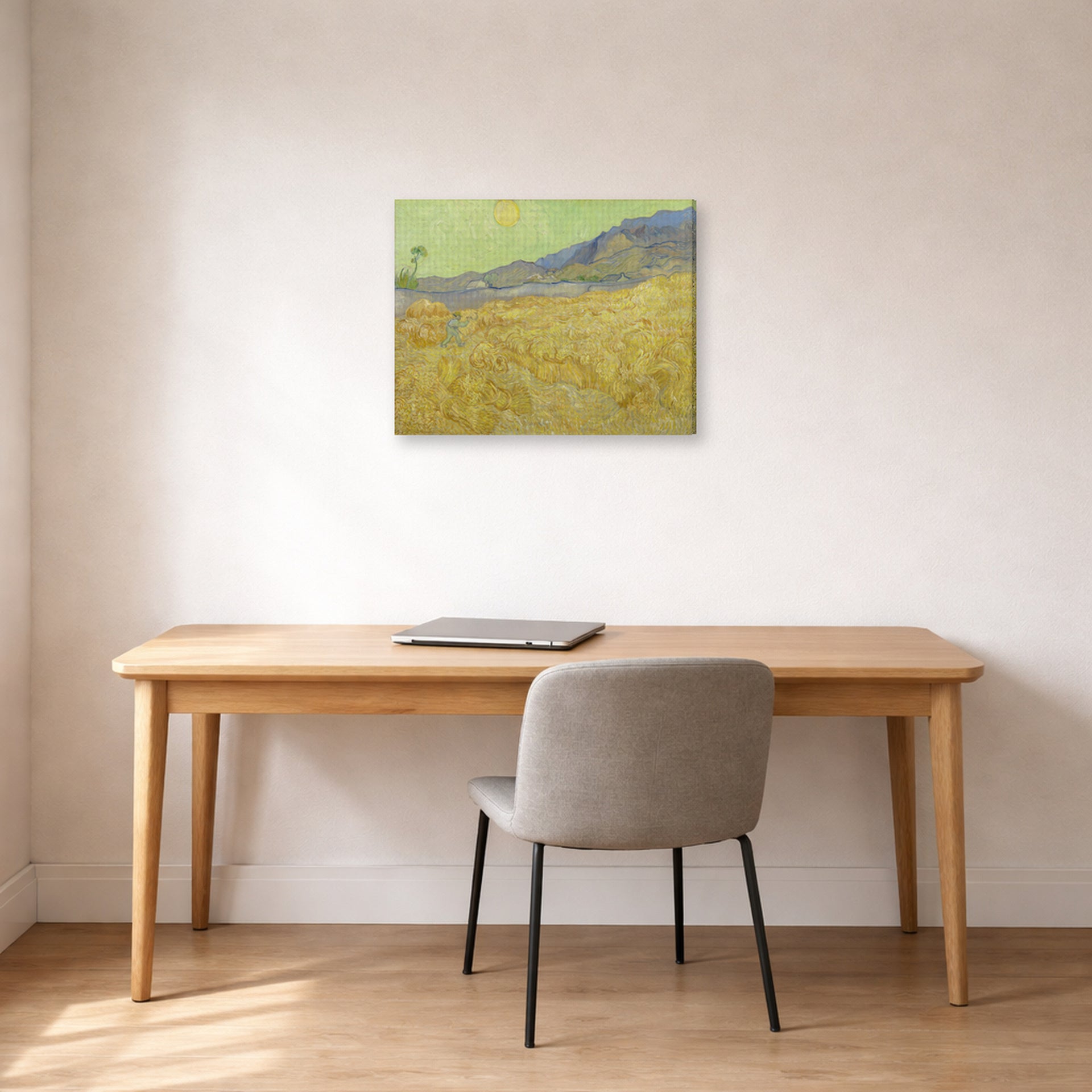 Gallery-wrapped canvas print of Vincent van Gogh's Wheatfield with a Reaper displayed on a wall in a home office