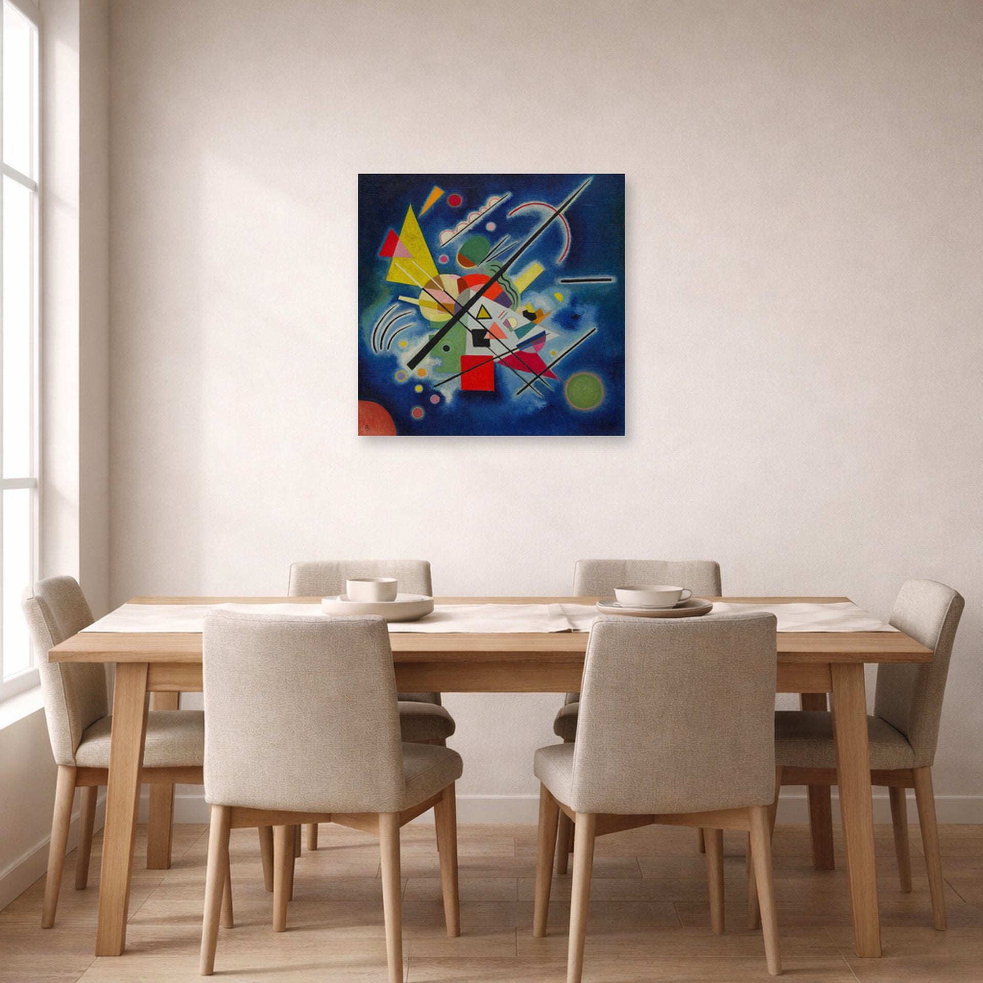 Unframed poster print of Wassily Kandinsky's Blue Painting displayed on a wall in a dining room