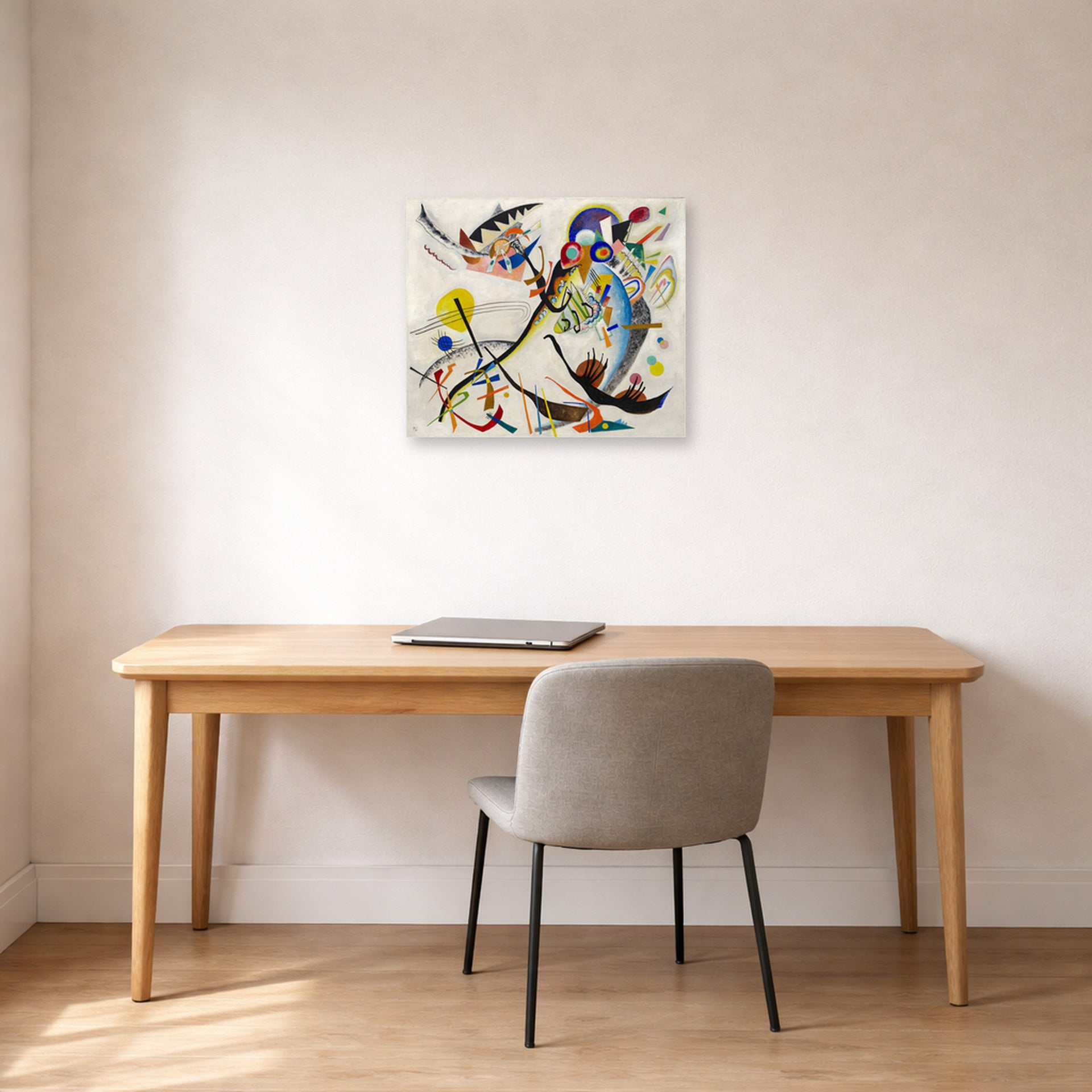 Unframed poster print of Wassily Kandinsky's Blue Segment displayed on a wall in an office