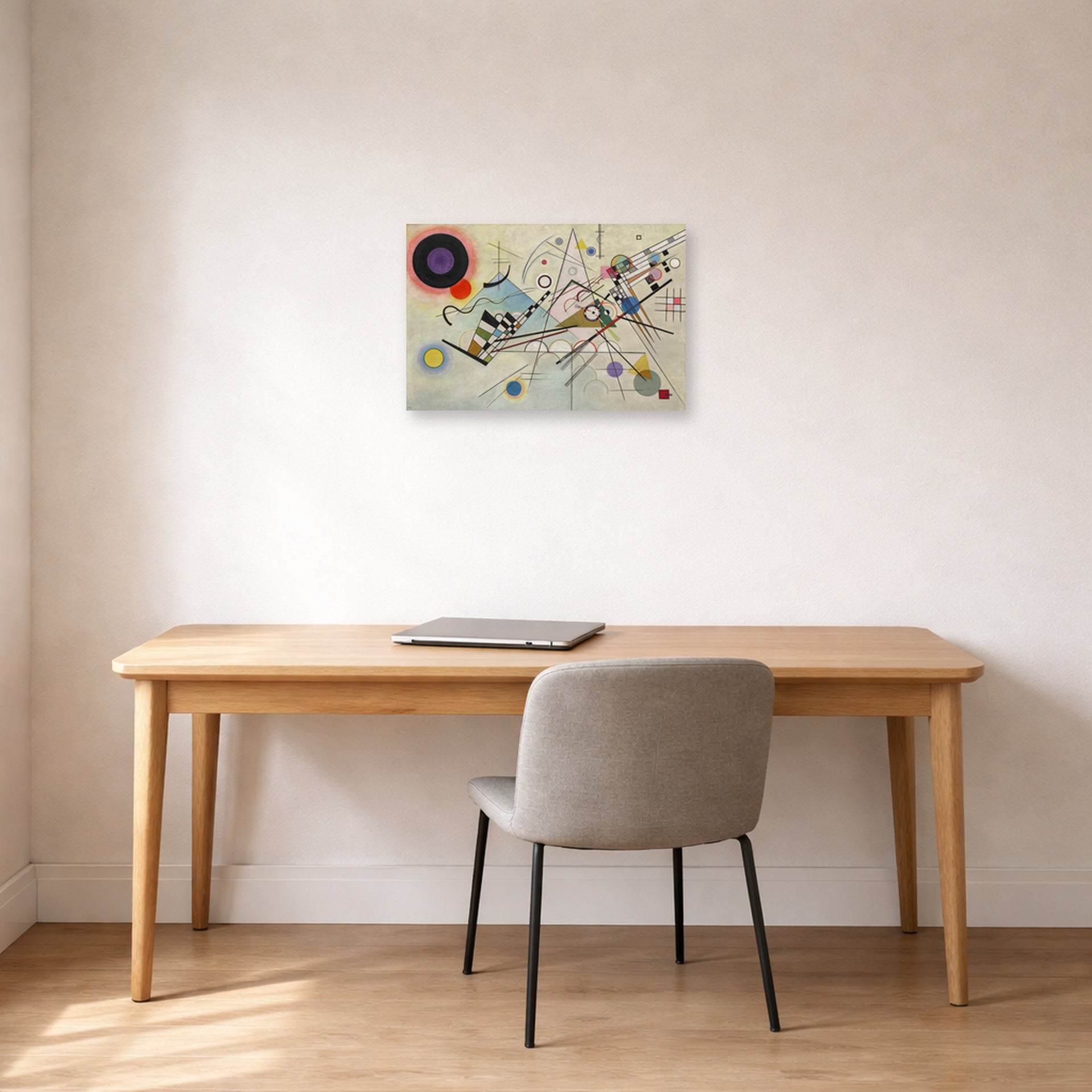 Unframed poster print of Wassily Kandinsky's Composition VIII displayed on a wall in an office