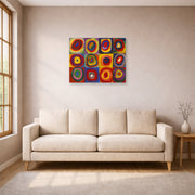 Unframed poster print of Wassily Kandinsky's Farbstudie Quadrate displayed on a wall in a living room