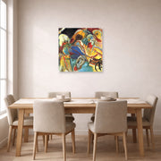 Unframed poster print of Wassily Kandinsky's Improvisation No. 30 (Cannons) displayed on a wall in a dining room