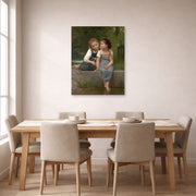 Unframed poster print of William-Adolphe Bouguereau's Pêche pour les grenouilles displayed on a wall in a dining room