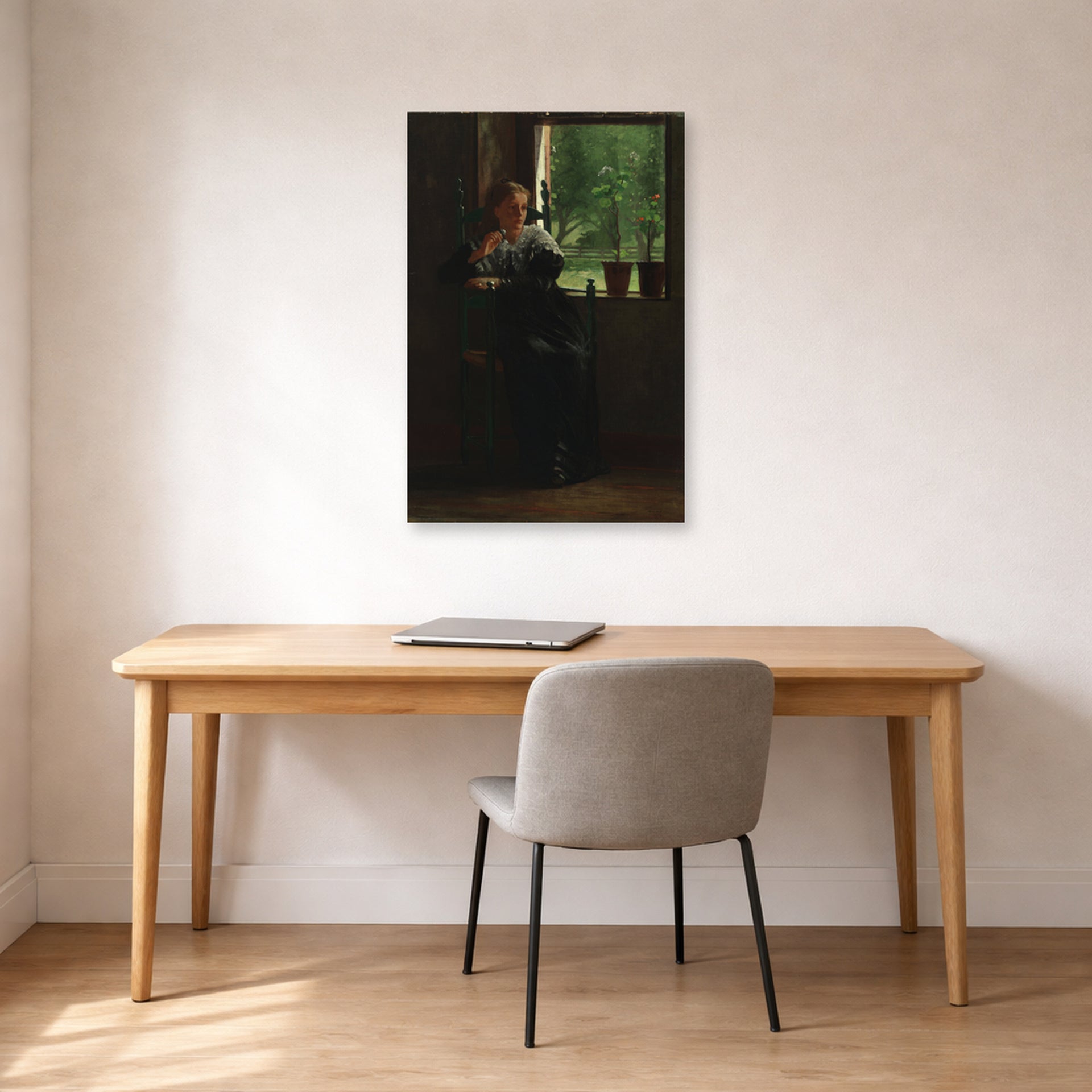Unframed poster print of Winslow Homer's At the Window displayed on a wall in an office