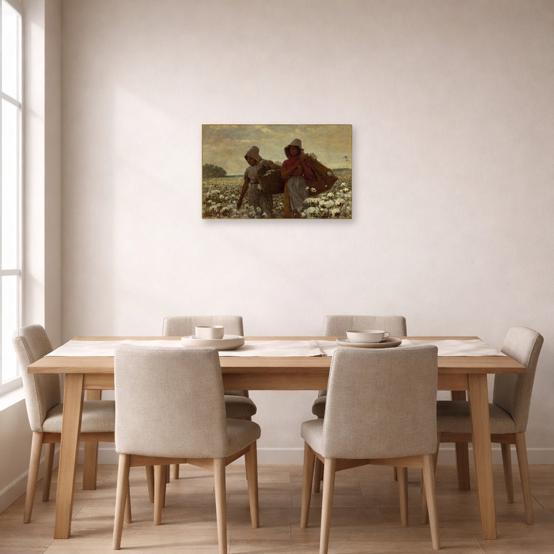 Unframed poster print of Winslow Homer's The Cotton Pickers displayed on a wall in a dining room